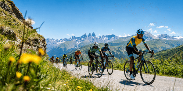 Cyclists climb a mountain road